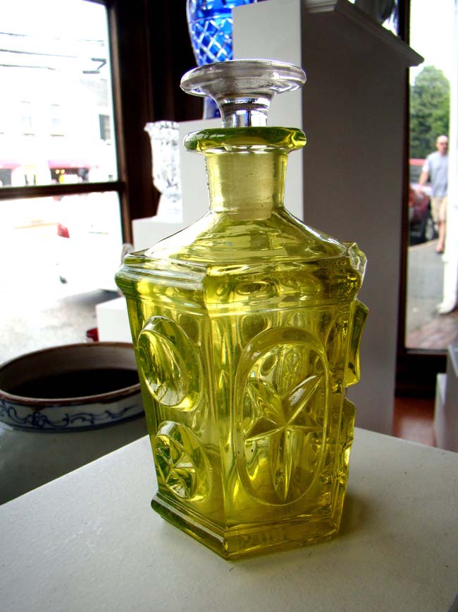 A lovely antique SANDWICH GLASS COMPANY canary yellow cologne bottle circa 1850 in the star and punty pattern